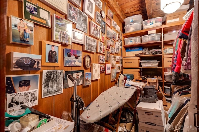 miscellaneous room with wooden ceiling and wood walls