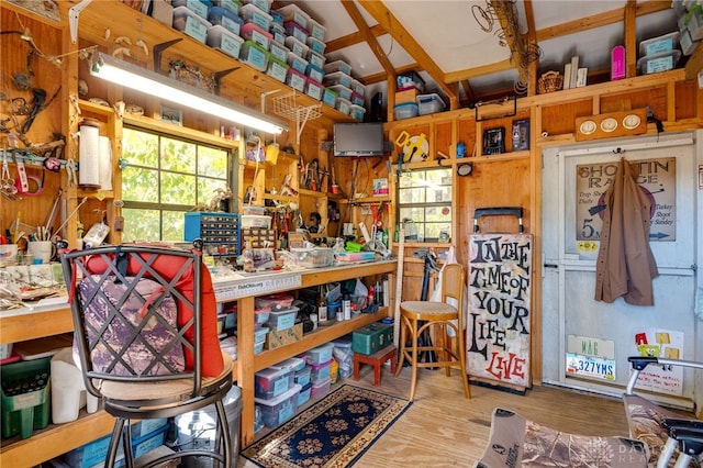 miscellaneous room featuring hardwood / wood-style floors and a workshop area