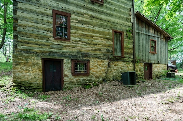 view of home's exterior with central AC