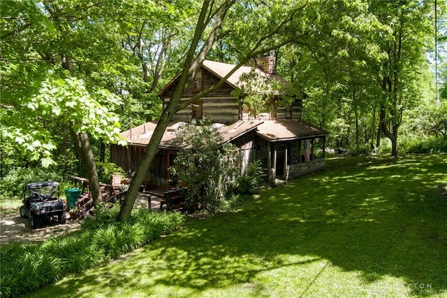 view of home's exterior with a yard