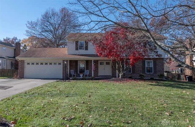 view of front facade with a garage and a front yard