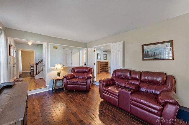 living room with dark hardwood / wood-style floors