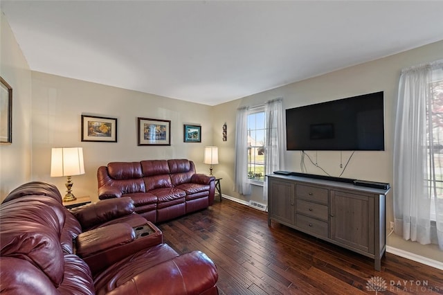 living room with dark hardwood / wood-style floors