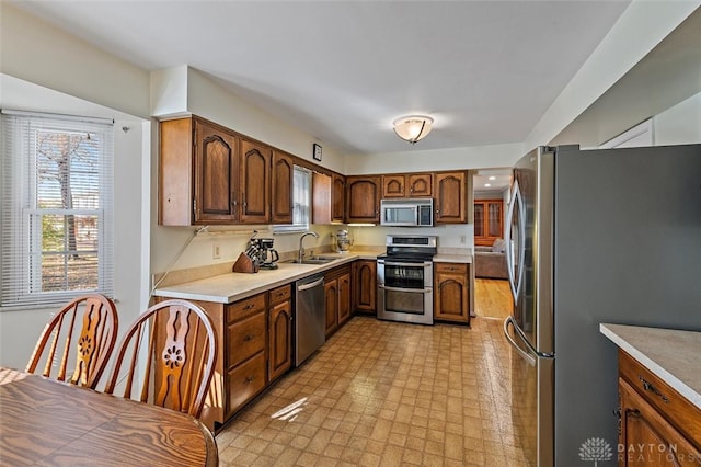 kitchen featuring stainless steel appliances and sink