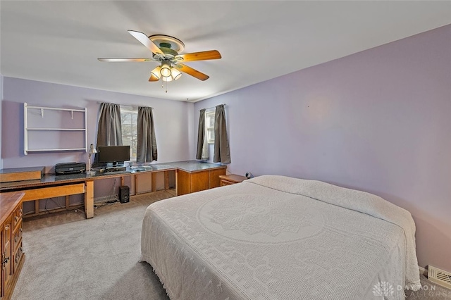 bedroom with light carpet and ceiling fan