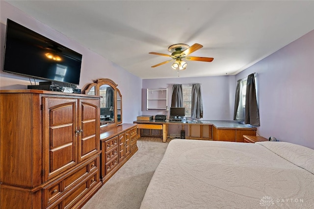 bedroom featuring light carpet and ceiling fan