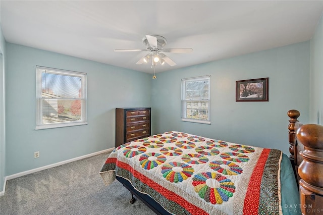 bedroom featuring multiple windows, carpet, and ceiling fan