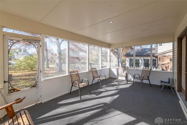 sunroom / solarium featuring a healthy amount of sunlight