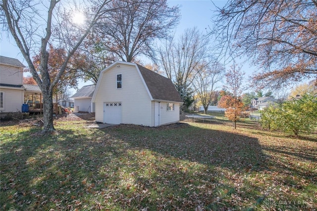 exterior space with a garage and a wooden deck