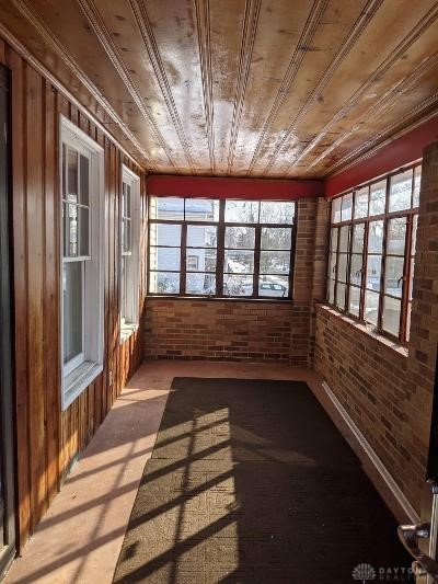 unfurnished sunroom featuring wooden ceiling