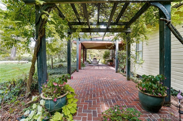 view of home's community with a pergola and a patio area