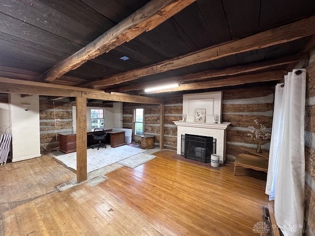 basement featuring hardwood / wood-style flooring, wooden ceiling, and a fireplace