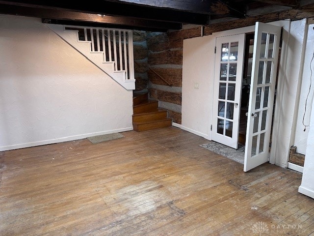 basement with hardwood / wood-style floors