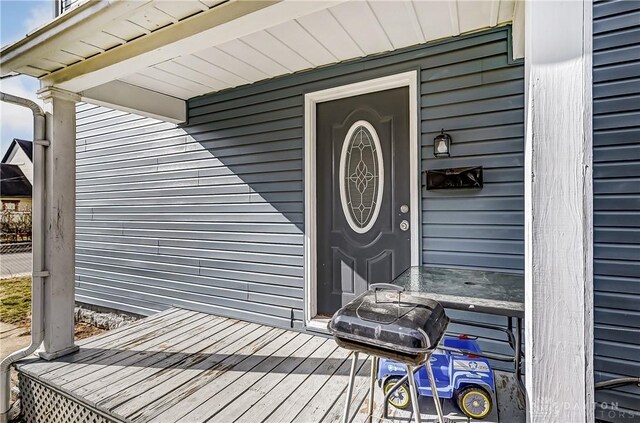 property entrance with a deck