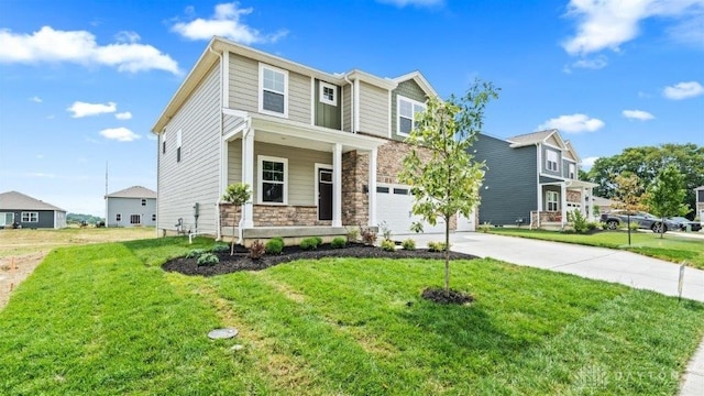 view of front of property featuring a front yard and a garage