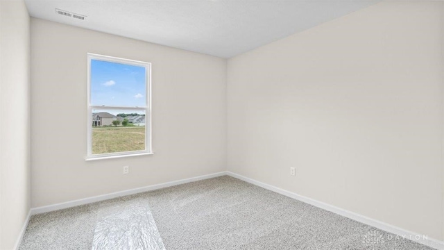 spare room featuring carpet flooring