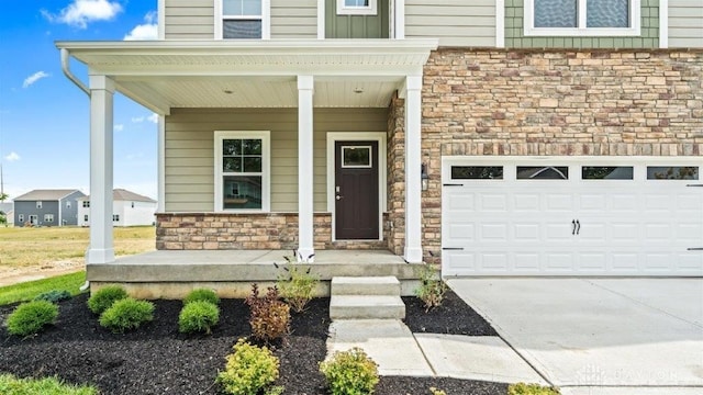 property entrance featuring covered porch and a garage