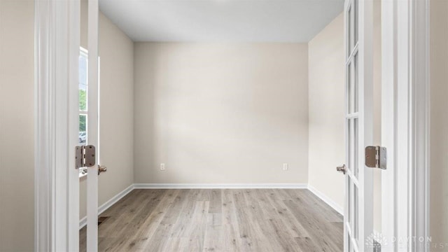 spare room featuring light wood-type flooring