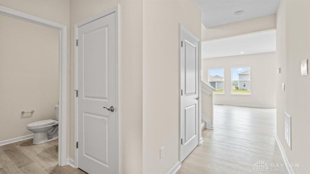 hall featuring light hardwood / wood-style floors