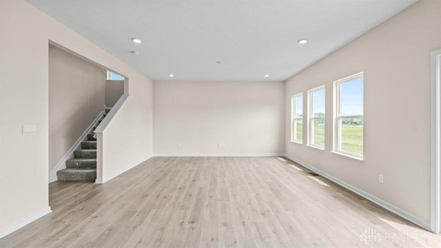 unfurnished living room with light wood-type flooring