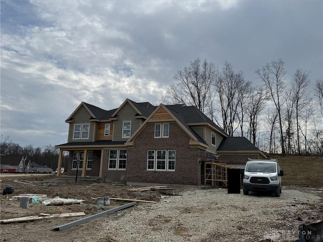 view of front of house featuring brick siding