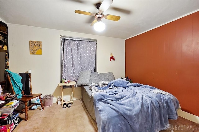 bedroom with light colored carpet and ceiling fan