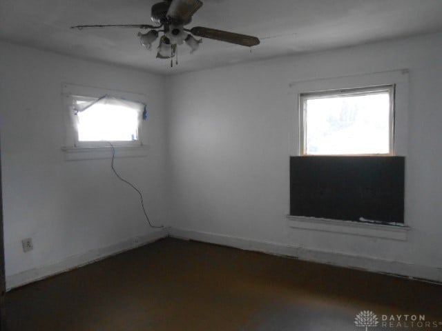 unfurnished room with ceiling fan