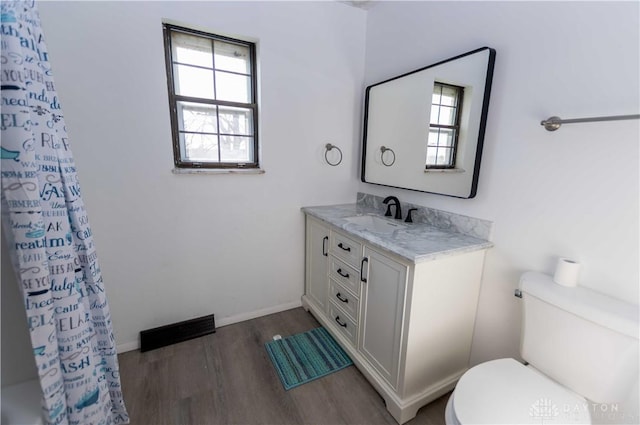 bathroom with vanity, wood-type flooring, toilet, and a shower with shower curtain