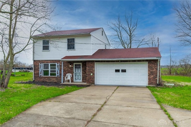 view of front of house featuring a garage and a front yard