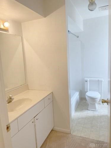 full bathroom featuring vanity, bathtub / shower combination, and toilet