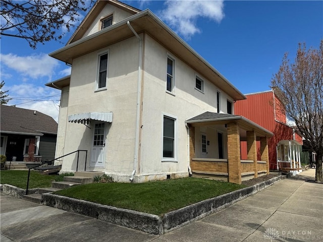 view of side of property with a yard