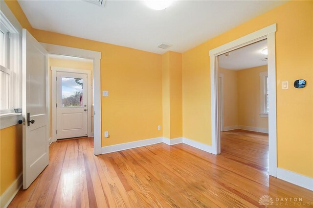 spare room featuring light hardwood / wood-style flooring