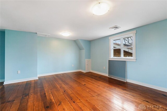 spare room featuring hardwood / wood-style flooring