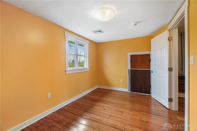 unfurnished bedroom featuring hardwood / wood-style floors