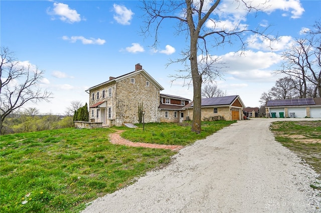 view of front of property with solar panels