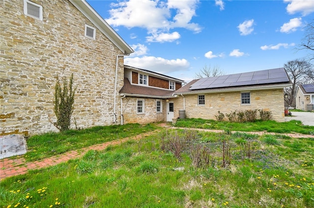 back of property with solar panels