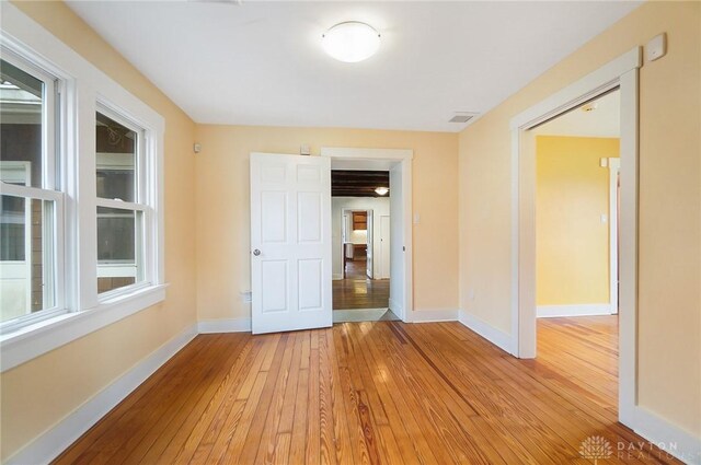 spare room featuring light hardwood / wood-style flooring