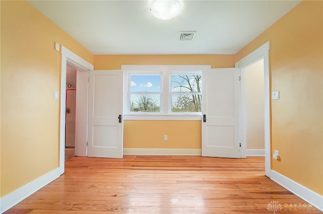 empty room with light wood-type flooring