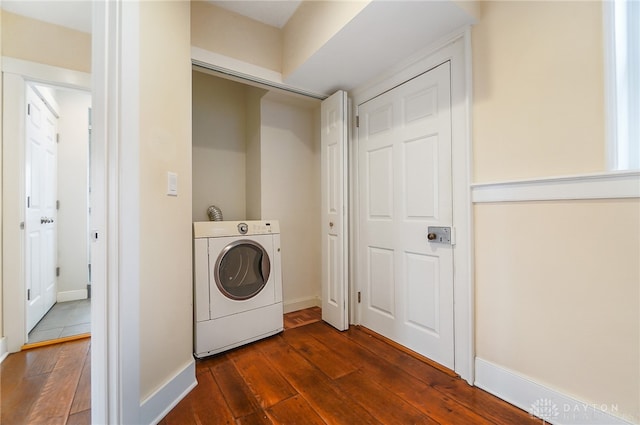 clothes washing area featuring washer / clothes dryer and wood-type flooring