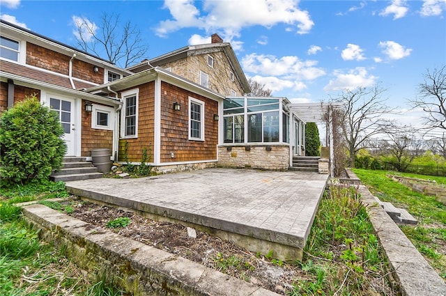 rear view of house featuring a patio