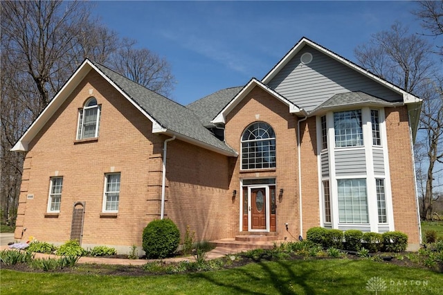 view of property featuring a front lawn