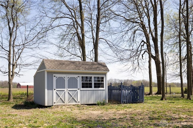 view of outbuilding with a yard