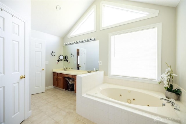 bathroom with lofted ceiling, tiled bath, tile patterned flooring, and vanity