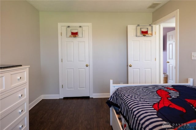 bedroom featuring dark wood-type flooring