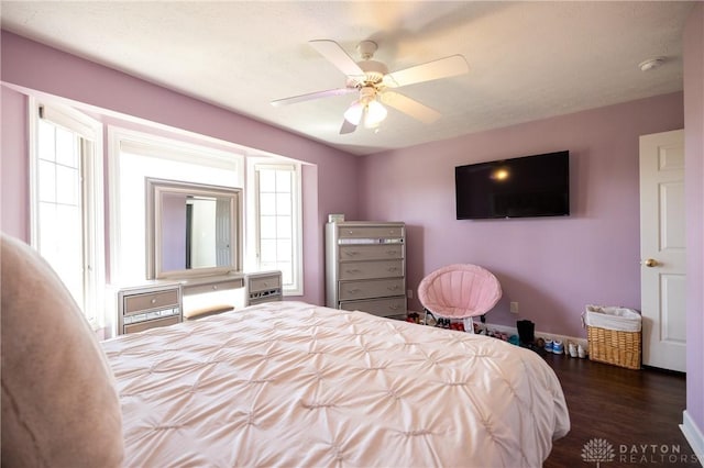 bedroom featuring ceiling fan and dark hardwood / wood-style floors