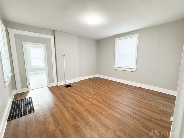 empty room featuring hardwood / wood-style flooring