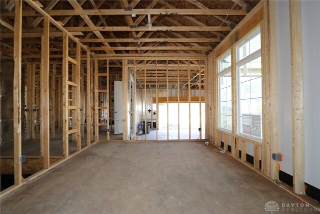 miscellaneous room featuring concrete floors and plenty of natural light