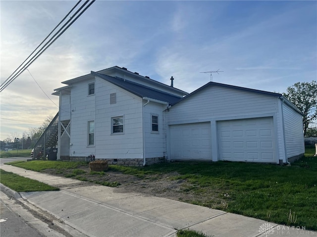 view of home's exterior with a garage