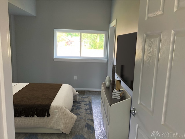 bedroom featuring baseboards