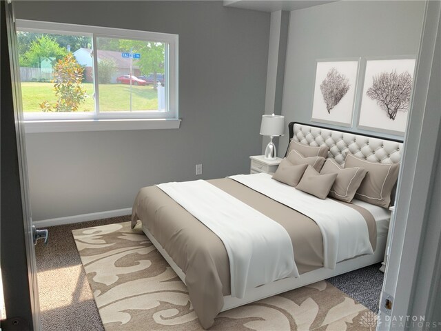 bedroom with multiple windows and carpet